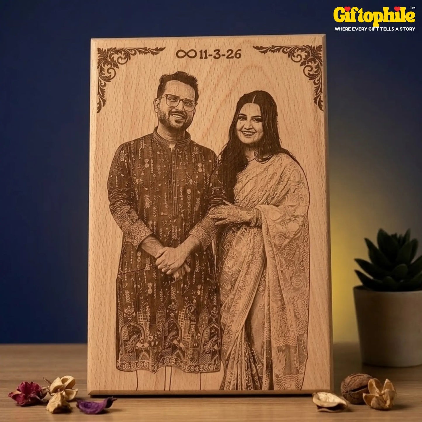Wooden plaque with laser-engraved portrait of a couple and personalized date, branded 'Giftophile'.