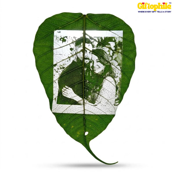Artistic design of a person holding a heart shape cut out of a leaf on a white background with 'Giftophile' branding.